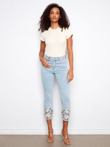 Denim jeans featuring a slim fit with floral embroidery at the hem, adding a touch of elegance to your casual look by Charlie B.