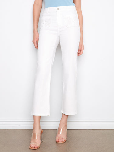 Cropped white denim pants featuring stretch fabric and eyelet embroidery for added style by Charlie B.