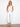 Designed with a modern cropped length, these elegant white pants are perfect for any wardrobe update. By Charlie B.