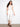 White cropped jeans featuring a slim fit and regular rise, perfect for versatile styling by Charlie B.
