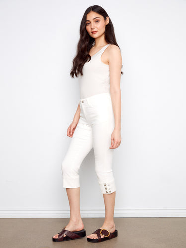 Cropped jeans in white with snap button detail at the cuff, enhancing their stylish appeal by Charlie B.