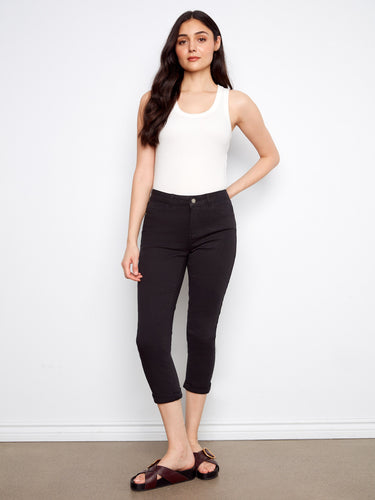 Black pants with a slim fit and stretch twill fabric, perfect for versatile styling. By Charlie B.