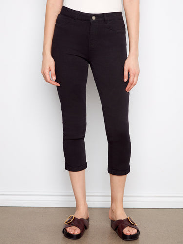 These black pants feature a cuffed hem, offering a chic and modern look for any occasion. By Charlie B.