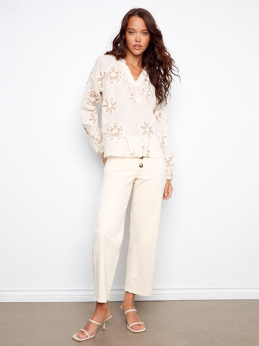 Elegant blouse featuring raglan sleeves and intricate floral embroidery for a graceful look by Charlie B.