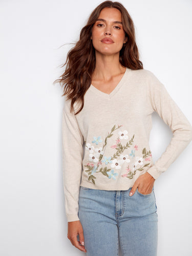 Chic beige V-neck sweater showcasing beautiful floral embroidery, designed with premium 100% cotton fabric by Charlie B.