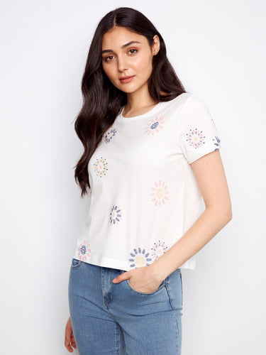This top features a classic crew neckline, adding a touch of elegance to its casual design. Made from 100% cotton by Charlie B.
