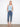 Denim jeans featuring a slim fit with a frayed embroidered tulip hem, adding a touch of elegance. By Charlie B.