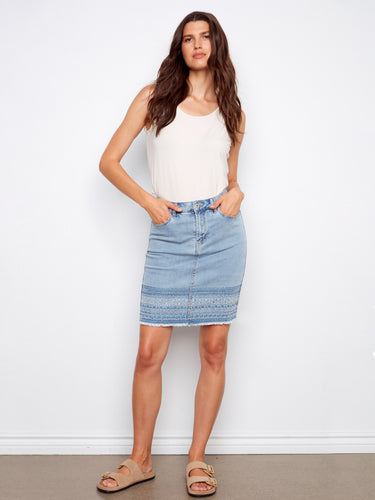 Denim skirt with slim fit, featuring an elegant embroidered hem for a stylish touch. Perfect for any casual outing by Charlie B.
