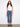 Denim pants with a stylish flared fit, featuring unique bow patch pockets for added charm. Crafted with attention to detail by Charlie B.