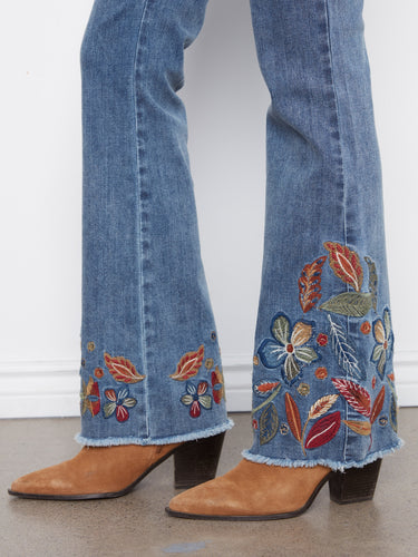Featuring a five-pocket design, these jeans combine functionality with fashion-forward embroidered patterns. By Charlie B.