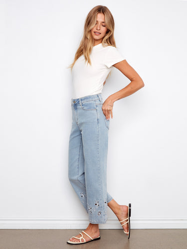 Regular rise flared leg jeans with intricate details, offering comfort and style in one package. Styled by Charlie B.