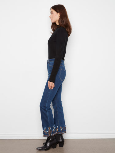 Embroidered hem detailing adds a unique touch to these chic denim jeans. By Charlie B.