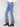 Long-length blue jeans with intricate floral embroidery on the sides, made from comfortable stretch denim by Charlie B.