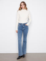 Flare fit jeans in stretch denim with a button-zip closure, designed for a chic casual look by Charlie B.