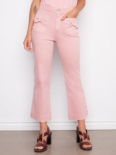 These cropped length pants feature charming bow patch pockets, adding a playful touch to your wardrobe by Charlie B.