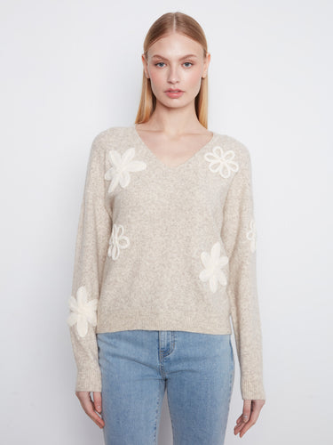 Almond sweater with long sleeves and delicate floral appliquĂŠs, perfect for a cozy look by Charlie B.