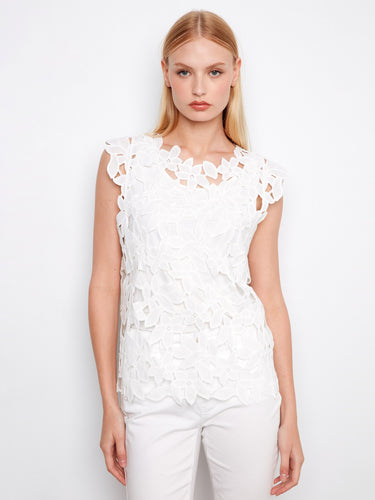 This top features a crew neckline, perfect for a classic and elegant look. The intricate design adds sophistication by Charlie B.