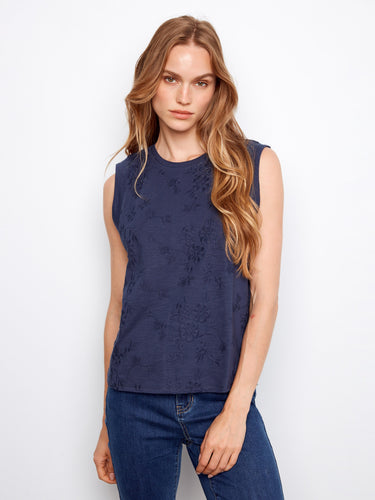 Navy cotton top with floral embroidery, highlighting its sleeveless design for a breezy feel by Charlie B.