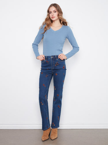 These jeans feature a straight leg design with exquisite floral embroidery, perfect for a stylish look by Charlie B.