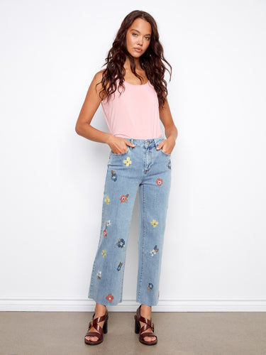 Light blue jeans with a cropped length and floral embroidery, ideal for casual outings by Charlie B.