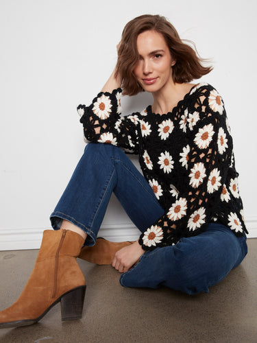 Stay cozy in long sleeves while embracing the detailed craftsmanship of this beautiful crochet creation by Charlie B.