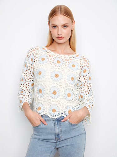 Floral crochet sweater with delicate scalloped hem and intricate detailing, perfect for adding elegance to any outfit by Charlie B.