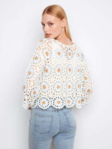 Elegant white and blue floral design with 3/4 sleeves, making it a versatile piece for any wardrobe by Charlie B.