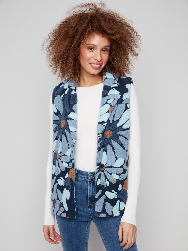 Floral Sherpa fleece vest in blue with practical two pockets, perfect for keeping essentials close by Charlie B.