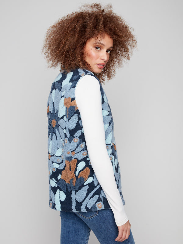 Blue floral design on this sleeveless vest made of plush Sherpa fleece, complete with a spread collar by Charlie B.