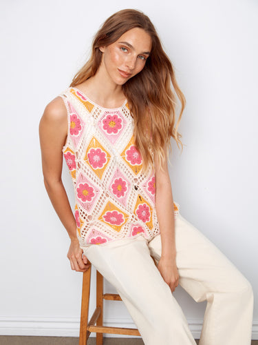 This stylish top showcases a lovely floral pattern, ideal for casual outings. The sleeveless design adds comfort and flair. By Charlie B.