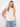 Elegant top featuring a scoop neckline, perfect for casual outings or dressing up. A versatile piece by Charlie B.