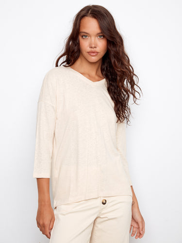 Elegant V-neck top with a relaxed fit and stylish 3/4 sleeves, perfect for any occasion. By Charlie B.