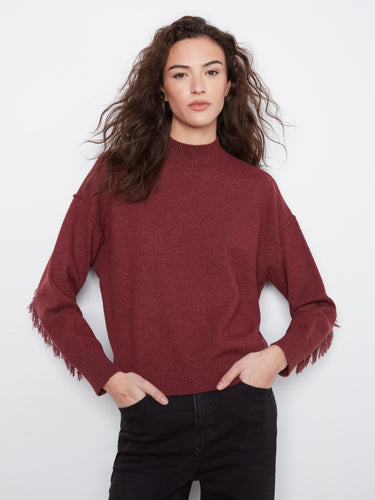 Merlot sweater featuring a chic mock neck and stylish fringe embellishments on the sleeves, perfect for cozy elegance by Charlie B.