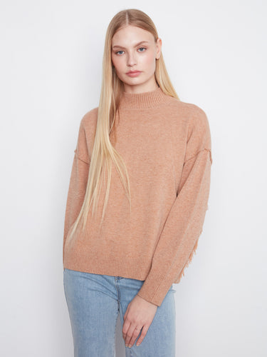 Cozy sweater with a stylish mock neck, perfect for chilly days. The warm hue adds a touch of elegance to any outfit by Charlie B.