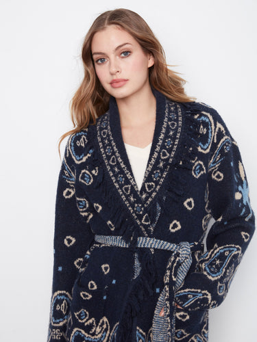 Geometric patterned navy cardigan with fringe details and convenient patch pockets, perfect for a cozy look by Charlie B.