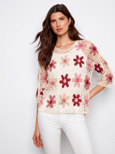 Stylish floral crochet top in soft carnation, crafted with attention to detail and 3/4 sleeves by Charlie B.