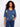 Blue sweater with a V-neckline featuring heart patterns, crafted for a relaxed fit. The elbow sleeves add a casual touch. By Charlie B.