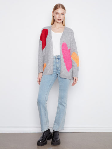 Stylish heather-grey cardigan adorned with vibrant heart prints, showcasing its open front design and relaxed charm by Charlie B.