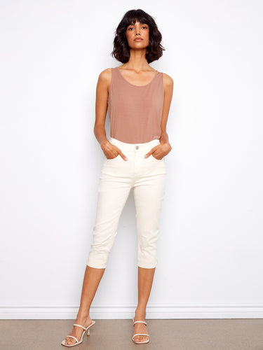 These pants feature a slim fit design, perfect for a sleek look. Crafted with care by Charlie B.