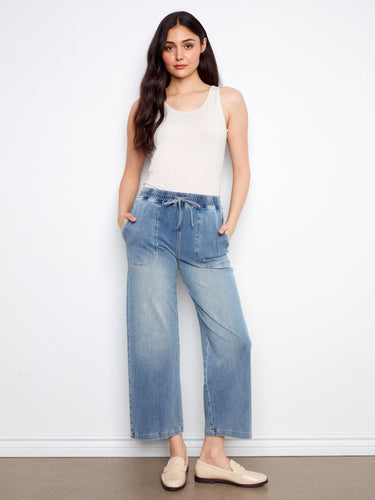 Blue knit denim joggers featuring slash pockets and a comfortable fit by Charlie B.