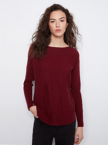 Deep red sweater with boat neck design, showcasing elegant styling by Charlie B.