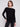 Black knit sweater featuring a stylish boat neck design and elegant front pockets by Charlie B.