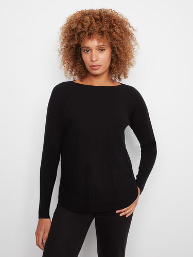 Black knit sweater with long ribbed sleeves and a boat neck, featuring front pockets for added style by Charlie B.