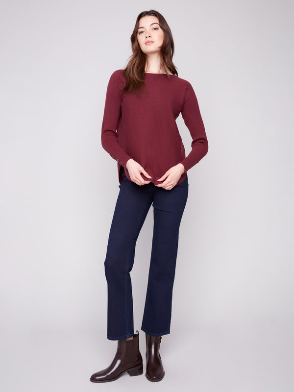 Stylish cabernet sweater featuring side pockets and rounded hem for both style and functionality by Charlie B.