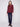 Knit sweater in rich cabernet color, offering comfort with its boat neck design and ribbed sleeves by Charlie B.