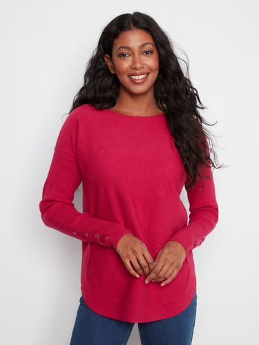 Truffle knit sweater with long ribbed sleeves and lace-up cuffs, featuring a stylish boat neckline by Charlie B.