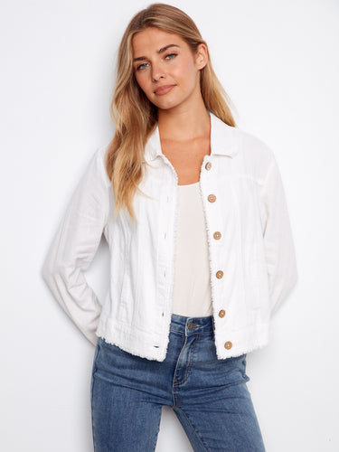 White denim jacket with frayed edges, featuring front button closure for a stylish look. Designed by Charlie B.