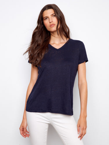 Navy linen blend T-shirt with a relaxed fit, paired stylishly with white pants for a casual look by Charlie B.
