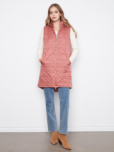 Rosebud-colored puffer vest with a quilted design and zip-front closure, perfect for a relaxed fit by Charlie B.