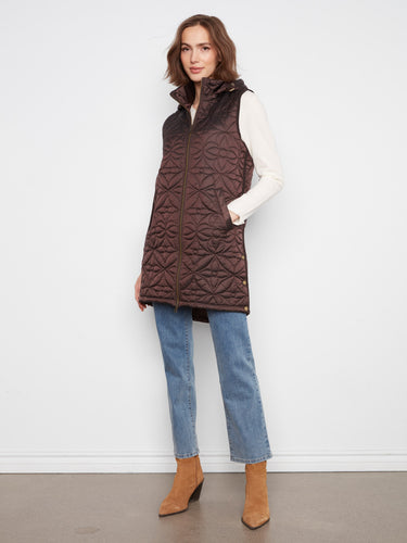 Brown vest with a quilted design, featuring a practical zip-front closure for easy wear. By Charlie B.